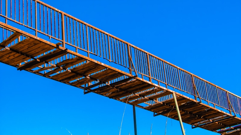 no people, 4K, built structure, blue, sky, connection, rusty, abandonment, low angle view, transportation, clear sky, bridge - man made structure, bridge