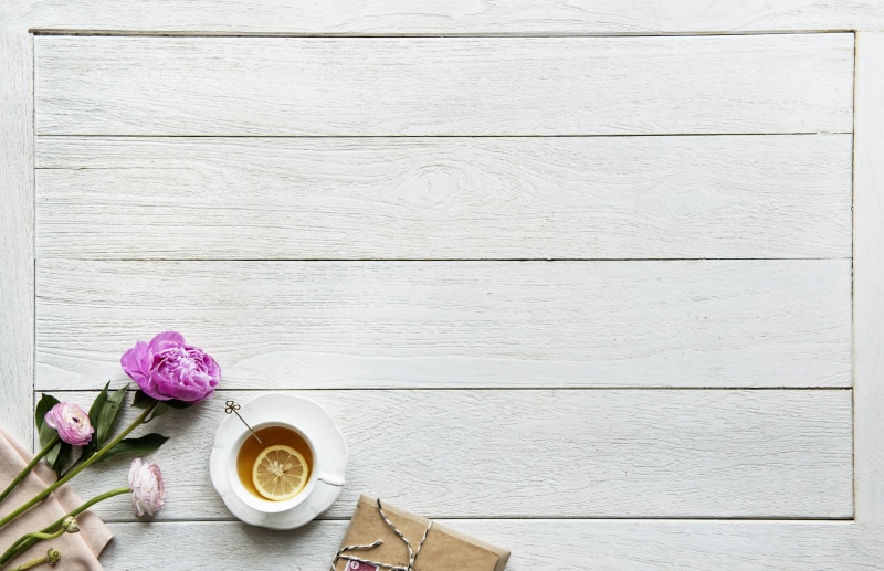 flowering plant, daytime, flower head, beautiful, cup, hot drink, morning, beauty in nature, flowers, flower, day, decoration, coffee - drink, table, coffee cup