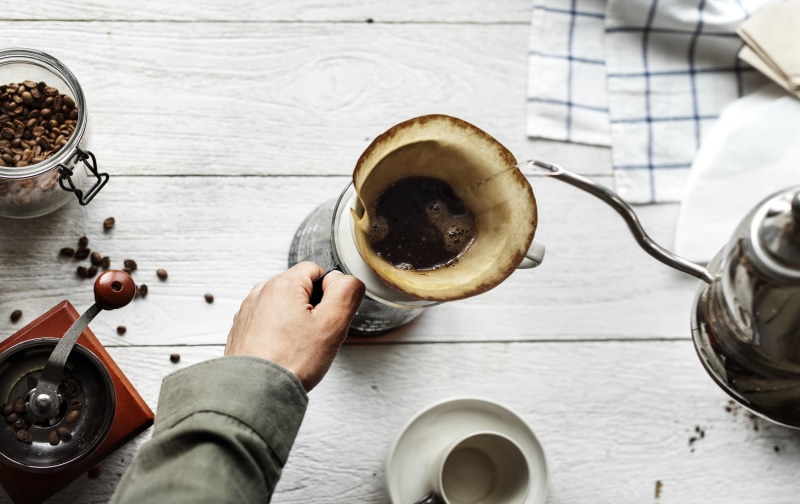 fresh, tags, relaxation, cup, high angle view, hobby, table, person, brew, barista, food, morning, indoors, food and drink, one person, human hand, mug