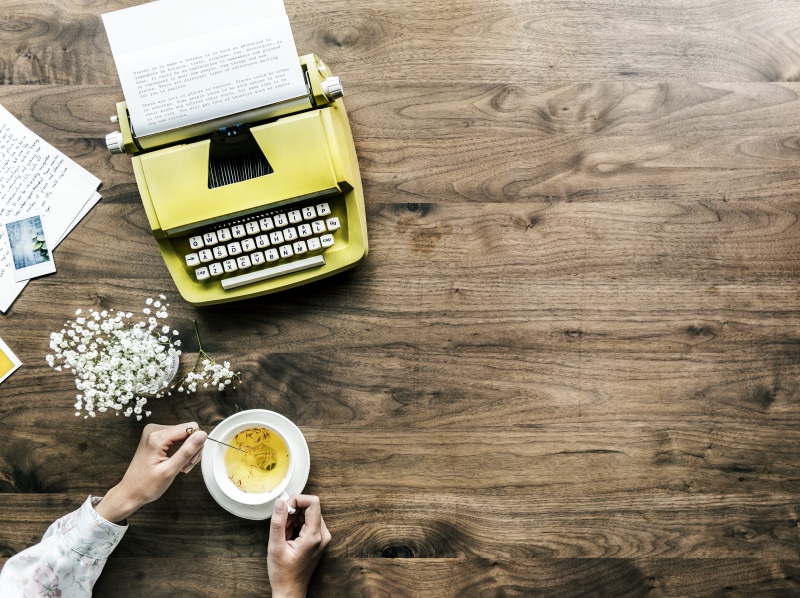 story, food and drink, drink, typewriter, cup, coffee cup, person, background, hot drink, lifestyles, machine, workplace, creative, lancer, holding, copyspace
