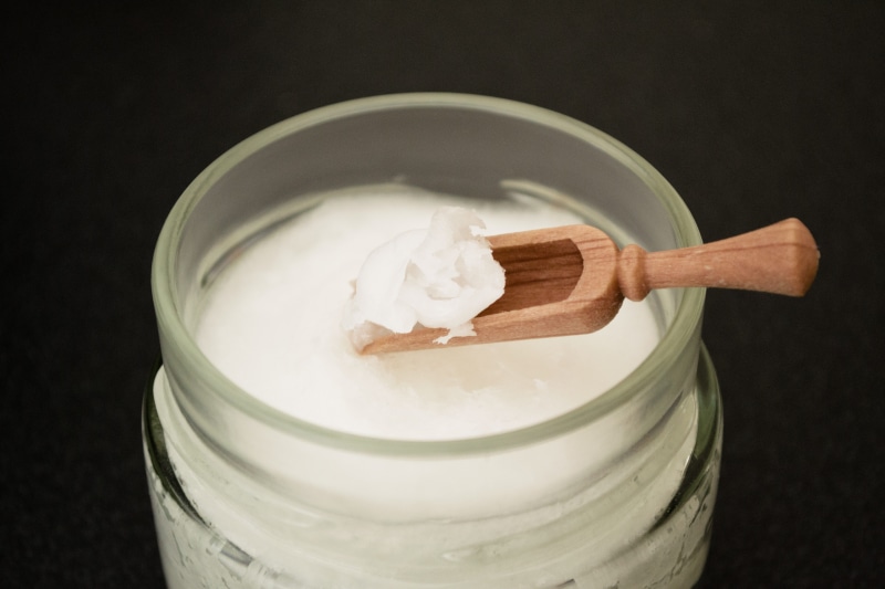 nut, coconut, ingredient, white color, drink, studio shot, delicious, supplement, beauty Product, wellness, black background, aroma, container, coconut oil on wooden spoon