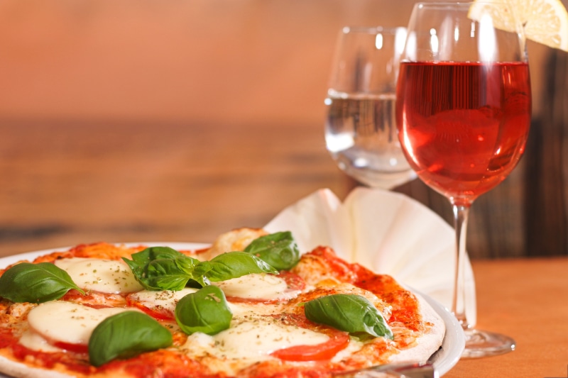 gourmet, restaurant, wineglass, cheese, italian food, wine, indoors, drink, Pizza, wood - Material, glass, herb, red, red wine, table, olive, meal, refreshment