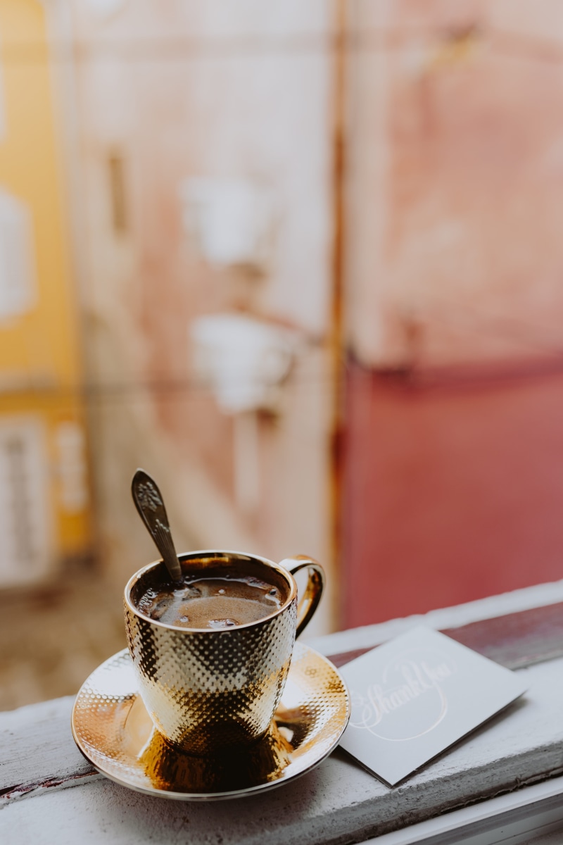 coffee, coffee - drink, tea cup, food and drink, eating utensil, cup, crockery, gold cup, 5K, drink, window, focus on foreground, coffee shop, saucer