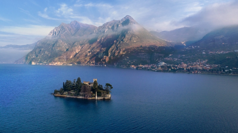 tranquility, mountain, waters, montisola, costa, sky, water, beauty in nature, island, passenger craft, color, cityscape, nature, land, building exterior