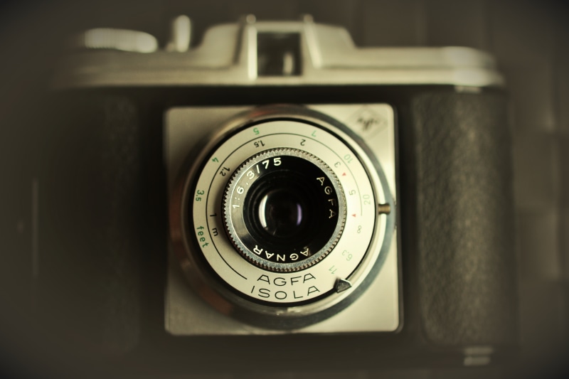 lens - optical instrument, geometric shape, day, agfa isola, circle, still life, photograph, vintage, camera, photographic equipment, number, close-up