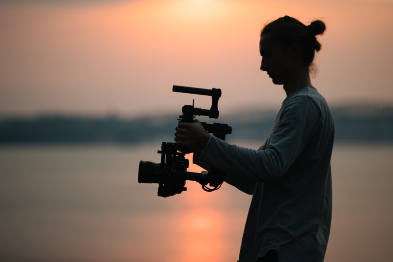 camera, holding, sun, photo, orange color, tripod, gimbal, silhouette, 4K, camera - photographic equipment, cinima, cinematographer, occupation, men, camera man