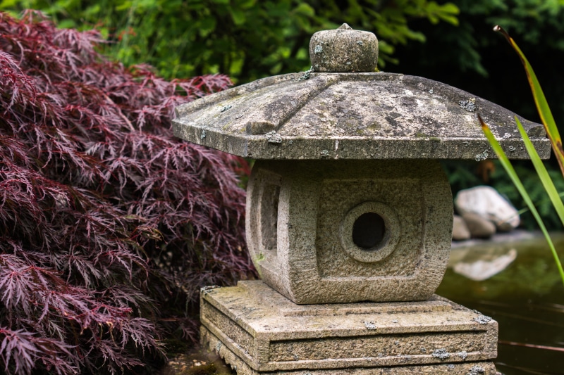 relaxation, religion, belief, japanese garden, close-up, lantern, built structure, spirituality, maroon, day, no people, outdoors, architecture, focus on foreground