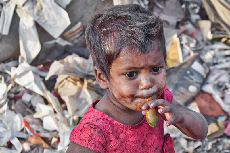 love, day, one person, people, young, headshot, outdoors, slums, focus on foreground, cute, men, eating, innocence, kid, casual clothing, looking at camera