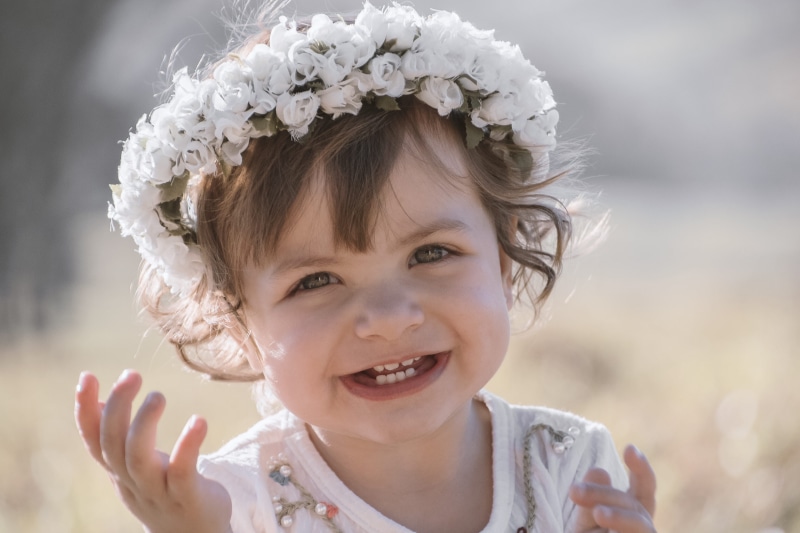 toddler, person, cute, 4K, innocence, nature, headband, smiling, wearing flowers, flower, looking at camera, wearing, child, blurred background, eyes