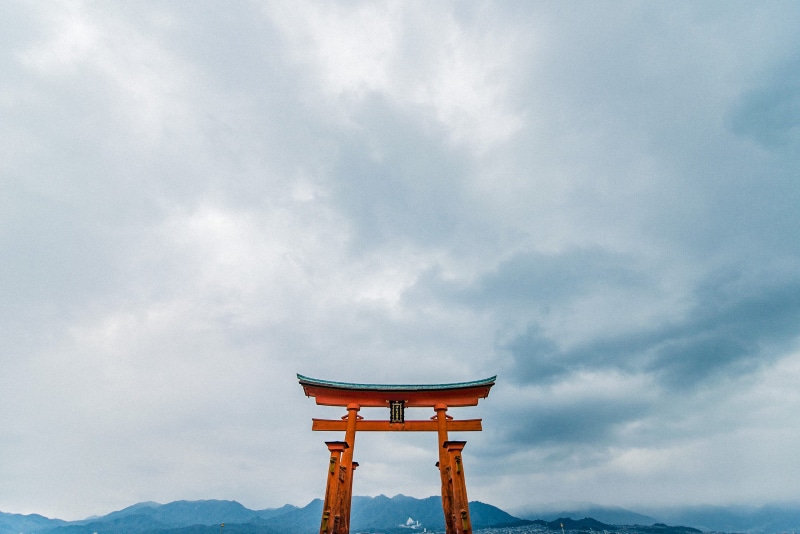 itsukushima shrine, outdoors, architecture, japan, belief, travel destinations, religion, built structure, hatsukaichi-shi, no people, mountain, travel