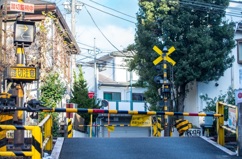 building exterior, yellow, railroad crossing, black, electricity, built structure, tree, connection, architecture, toll, sign, sky, Japan, 2K, gate, city