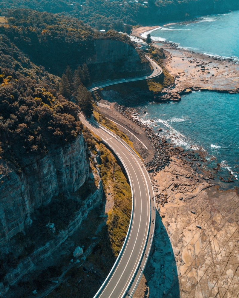 winding road, beach, travel, green, birds eye view, beauty in nature, leafed, aerial view, road, high angle view, mode of transportation, water, outdoors