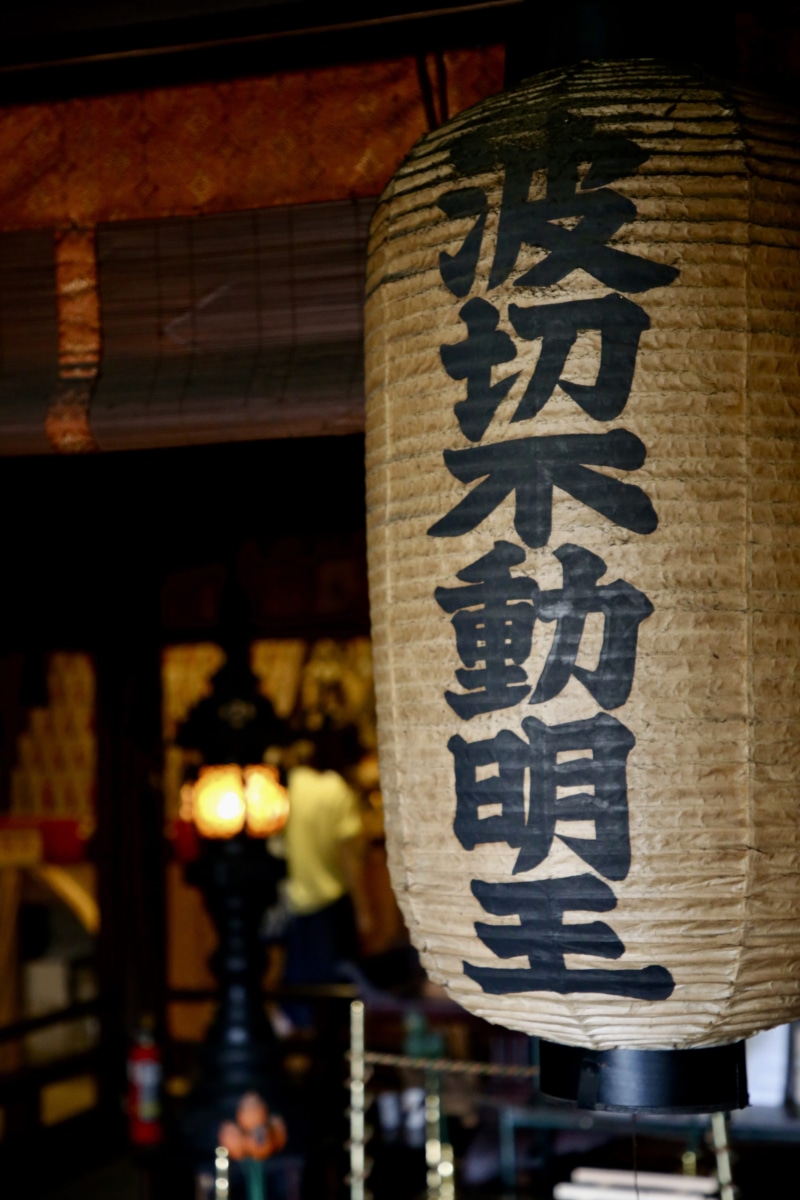 lamp, paper, communication, night, handwriting, hanging, pinata, built structure, architecture, illuminated, wood, human, lighting equipment, plywood, lantern