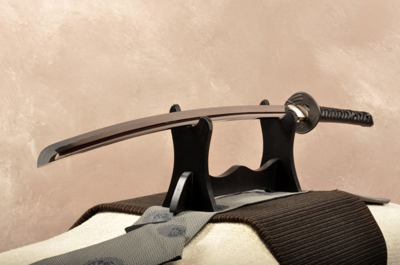 4K, equipment, clothing, studio shot, on the stand, metal, black, without a sheath, retro Styled, indoors, old, human limb, human leg, sword, black color