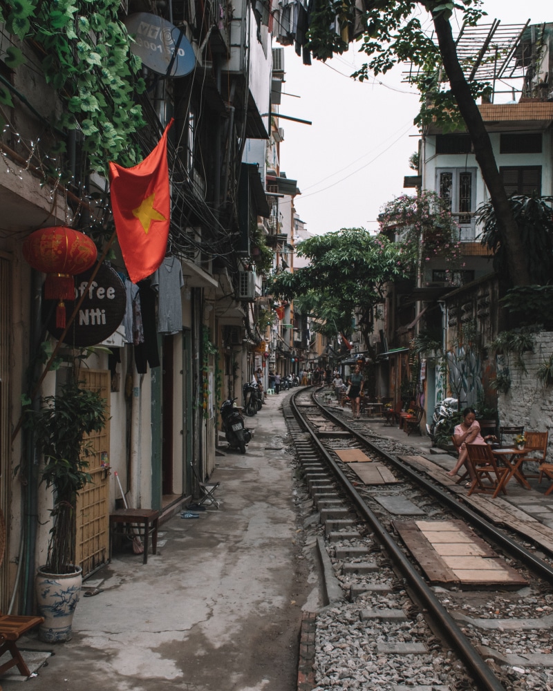 transportation, nature, day, the way forward, town, outdoors, train street, urban, flag, trains, flagstone, vietnam, city, track, patriotism, hanoi, built structure