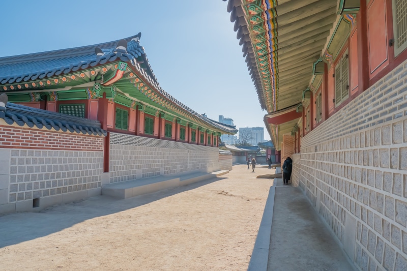 housing, building, real people, city, asian, day, travel, direction, place of worship, outdoors, incidental people, worship, shrine, person, flagstone
