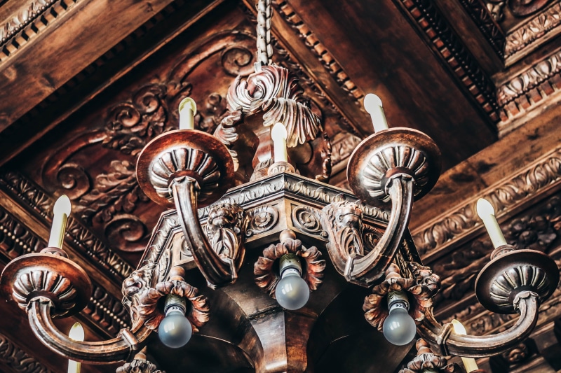 belief, indoors, ceiling, close-up, uplight, the past, art, spirituality, lit, ornate, creativity, human representation, no people, lights, low angle view