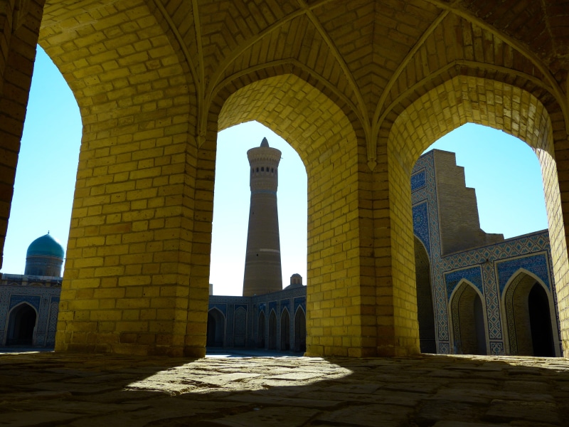 history, kalon mosque islam, tourism, brown, outdoors, arched, building, day, travel destinations, built structure, sky, shadow, building exterior, the past