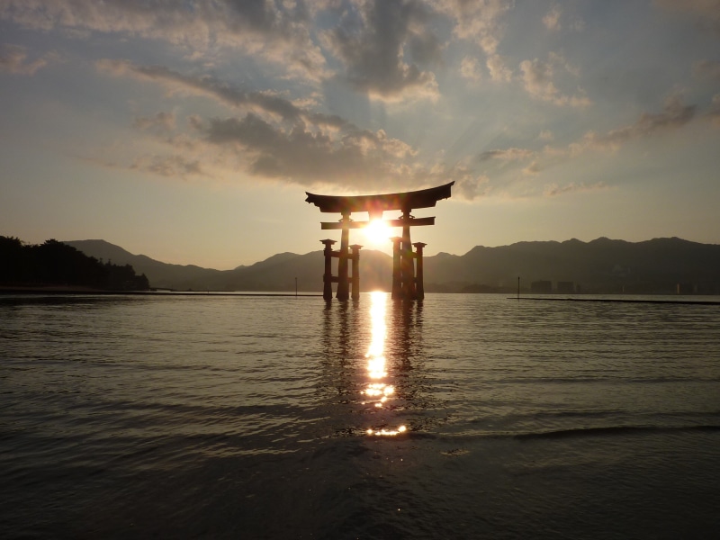 lens flare, sky, hiroshima, 2K, waterfront, built structure, torii, silhouette, water, beauty in nature, tranquility, gate, reflection, cloud - sky, no people