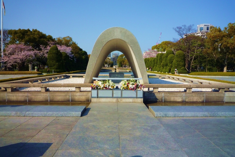 clear sky, pool, incidental people, hiroshima, sky, outdoors, building exterior, built structure, water, arch, travel destinations, swimming pool, reflection
