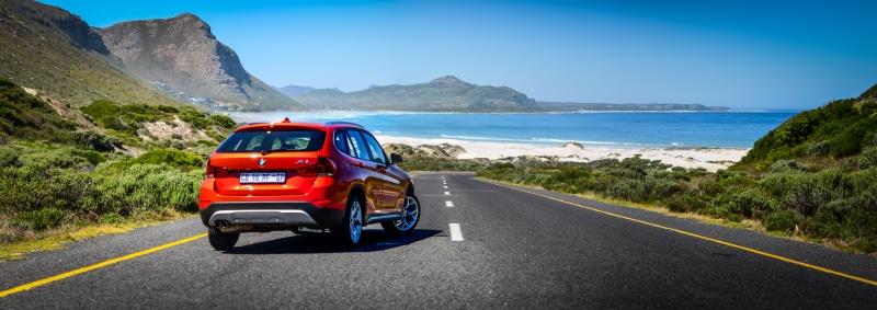 body, gray, 8K, transportation, travel, crossover SUV, landscape, mountain, speed, BMW  X1, asphalt, water, Nikon, red, road, Sporty, outdoors, near, car