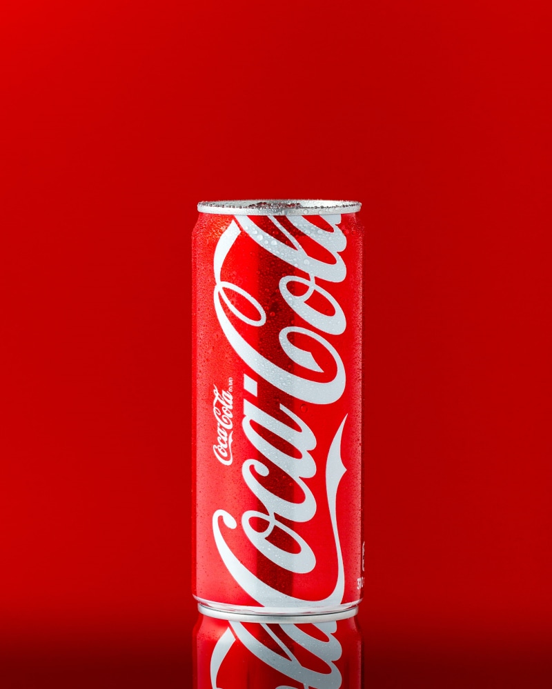 chinese new year, single object, red, colored background, holiday, cola, close-up, studio shot, calligraphy, chinese food, no people, 2K, indoors, red background