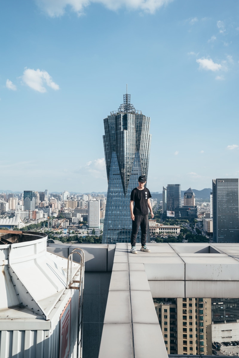 top, roof, day, standing, fashion, business, dingyiran, men, building, adult, cityscape, shadow, hangzhou, famous Place, man, males, building Exterior
