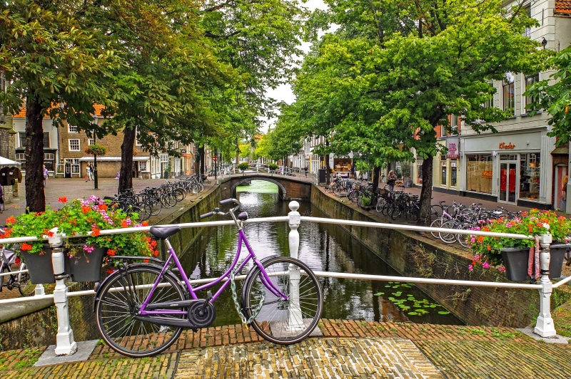 metal, handrail, railing, river, day, growth, built structure, netherlands, building exterior, no people, bicycle, parking, parked, europe, water, landscape