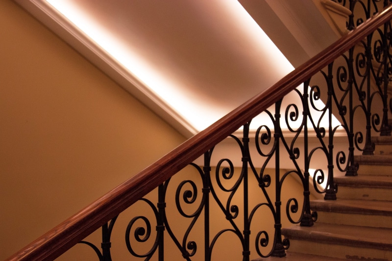 residential district, aesthetic, yellow, ceiling, up, wall - building feature, light, ornate, geometry, staircase, stair, wrought iron, railing, design