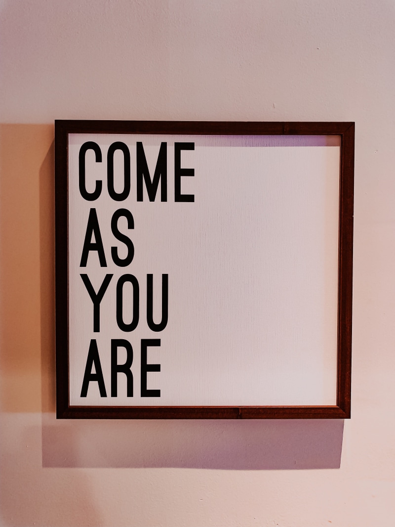 advertisement, capital letter, western script, alphabet, white board, studio shot, paper, indoors, information sign, room, canvas, poster, building, wall