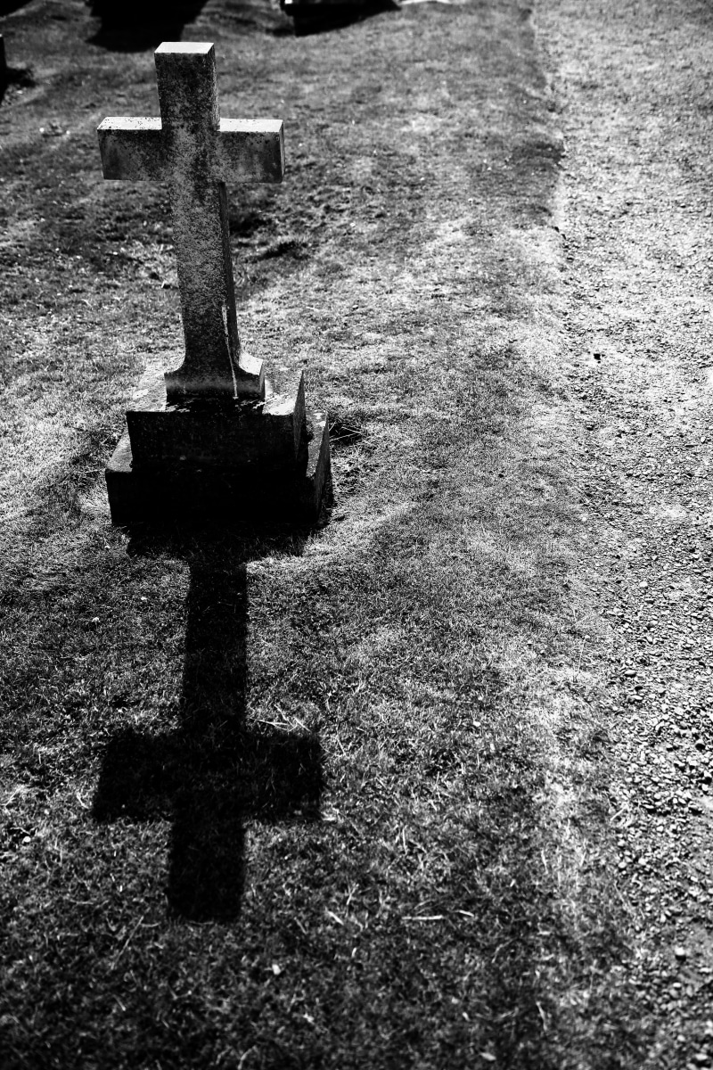 symbol, nature, outdoors, gray, envelope, back, interior design, letter, indoors, memorial, cemetery, tomb, death, cross, spirituality, animal, crow, stone