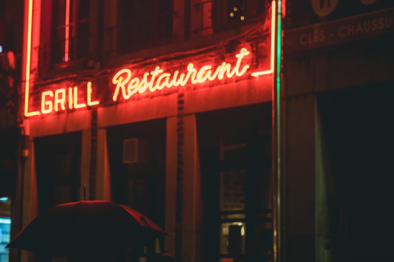 city, forge, business, built structure, commercial sign, sign, alphabet, grand theft auto, night life, light, no people, bar counter, red, cafe, text, architecture