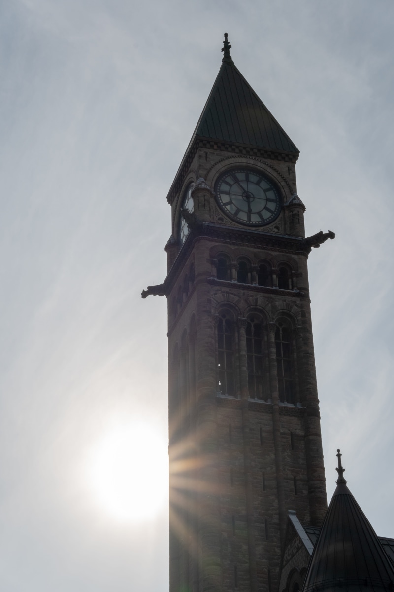 machine, building, built structure, low angle view, temple, analog clock, steeple, spirituality, flare, wheel, worship, alloy wheel, tower, wall clock