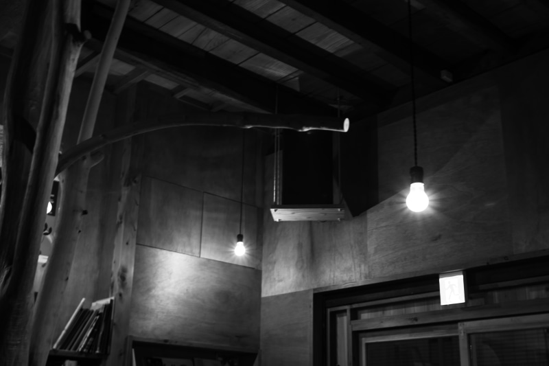 electric lamp, building, illuminated, handrail, corner, window, fireplace, architectural column, banister, lighting, electricity, wheel, no people, low angle view