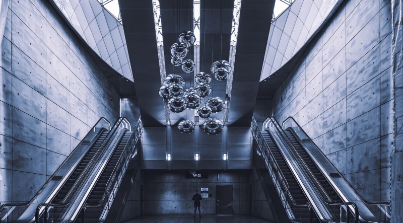 terminal, travel, town, modern, wall - building feature, person, low angle view, architecture, planetarium, railing, airport, lighting, steps and staircases