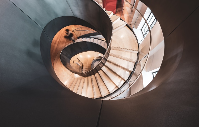 spiral, stairs, built structure, drink, insect, standing, indoors, modern, cricket insect, coil, invertebrate, brown, lighting equipment, tower, high angle view