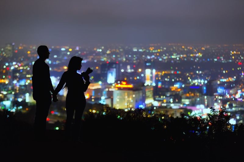holding hands, cityscape, hollywood, urban, crowd, nightlife, light, building exterior, town, human, night life, adult, photographer, two people, city