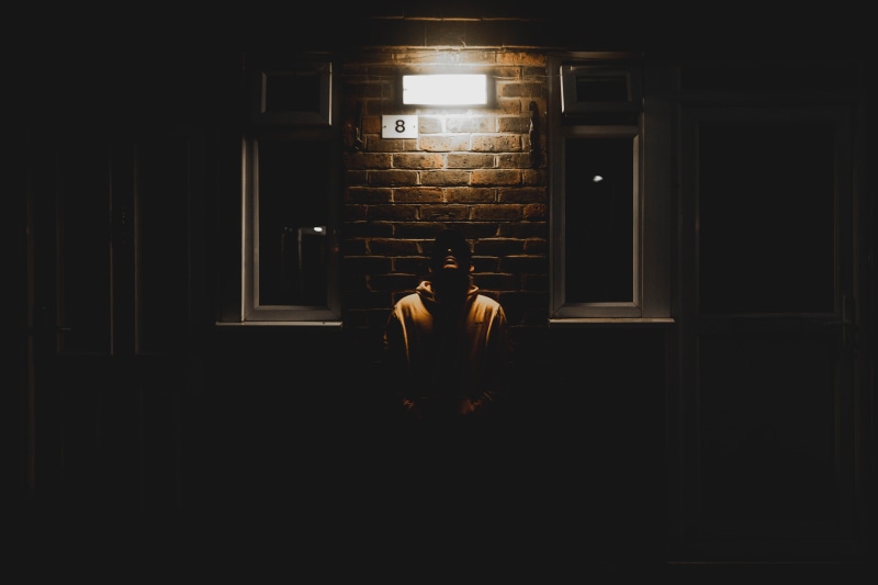 flare, wall, leaning, shadow, positive emotion, brick wall, crypt, men, clothing, light, silhouette, apparel, architecture, togetherness, human, people