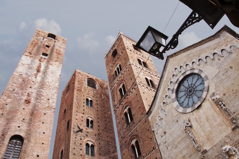 no people, history, sky, middle ages, travel destinations, albenga, ancient, europe, place of worship, italy, low angle shot, clock tower, tower, clock face