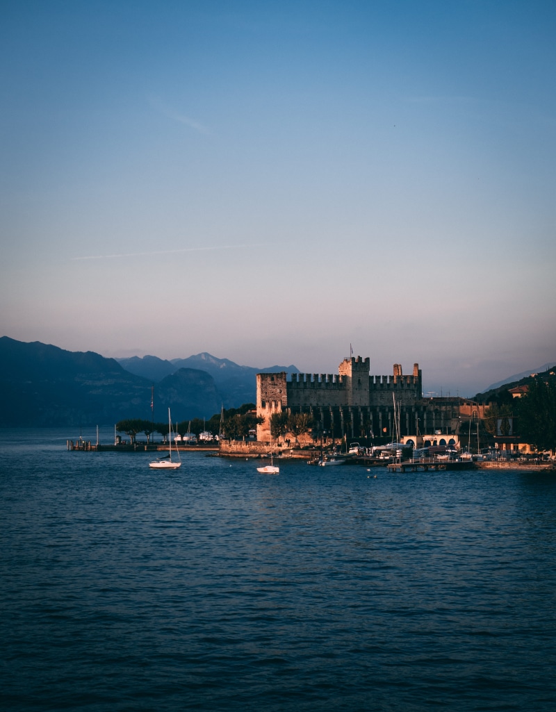 mountain, architecture, built structure, beauty in nature, water, city, building, waterfront, scenics - nature, no people, 4K, sailboat, clear sky, bay