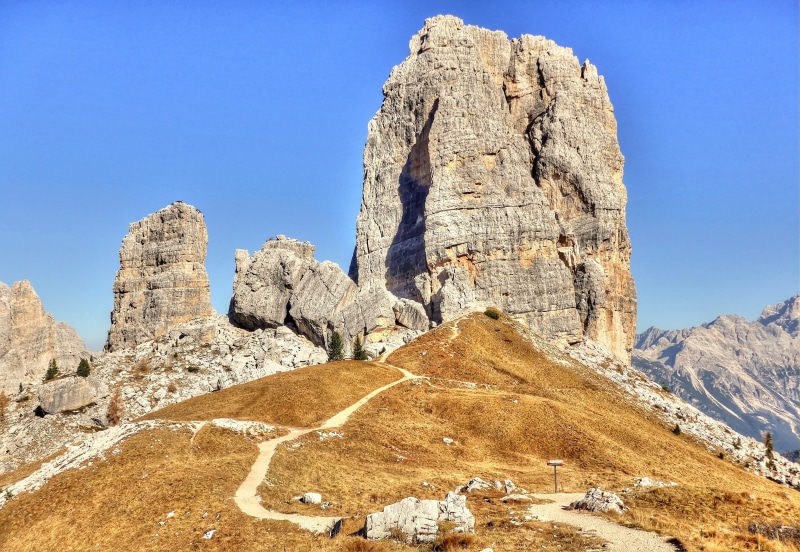 rock needles, non-urban scene, belluno, meadow, tranquil scene, alpine, beauty in nature, clear sky, geology, 4K, dolomites, day, climate, semi-arid, arid climate