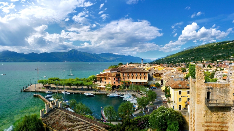 building Exterior, tourism, Italy, blue, vacations, building, italian Culture, lake, europe, landscape, residential district, castle, famous Place, scenics
