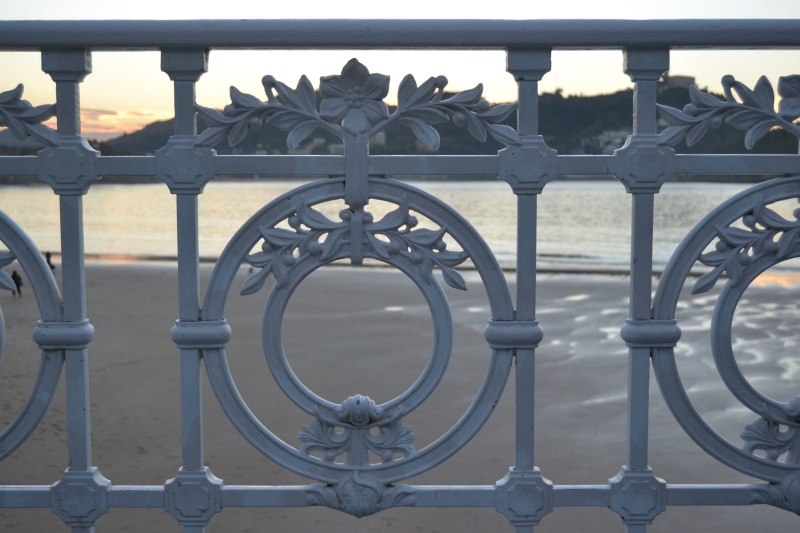 boundary, beach, focus on foreground, barrier, metal, wrought iron, shape, day, sea, sunset, euskadi, gate, protection, fence, shell, donostia, costa, outdoors