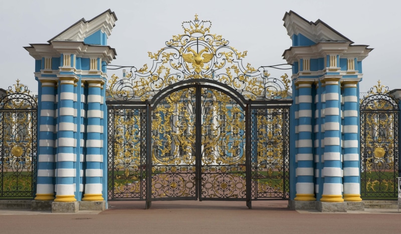 outdoors, wrought iron, religion, belief, architecture, catherines, building exterior, closed, plant, sky, gate, ornate, built structure, no people, entrance