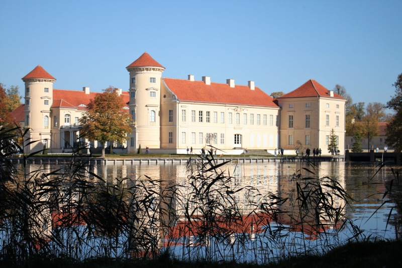 architecture, row house, outdoors, sky, river, clear sky, castle, building exterior, travel destinations, tree, water, 4K, built structure, brandenburg