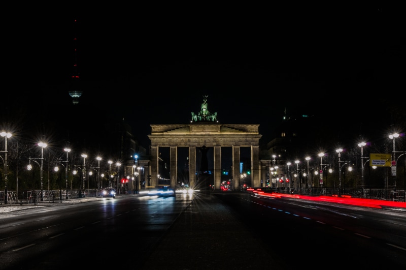 illuminated, long exposure, architectural column, window, building, hotel, gate, transportation, city gate, outdoors, history, light trail, lane, brandenburg
