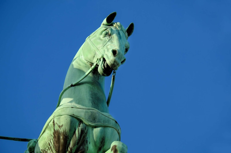 outdoors, sculpture, female likeness, copy space, berlin, copper, no people, 4K, one animal, mammal, day, statue, low angle view, clear sky, turquoise colored