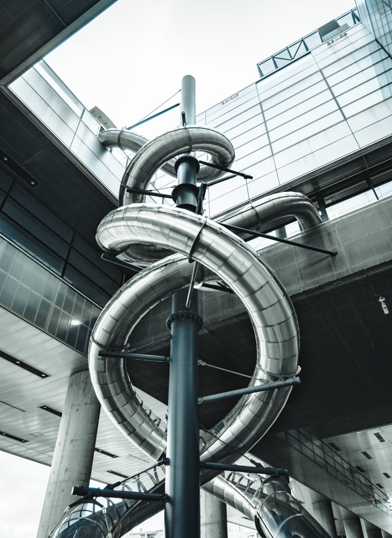 building, pipe - tube, plumbing, factory, urban, metal, sky, built structure, industry, city, banister, connection, handrail, metropolis, close-up, steel