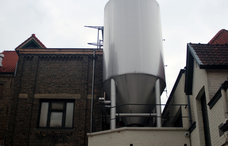 outdoors, city brewery, window, low angle view, city, roof, pipe - tube, brew, belgium, smoke stack, industry, delicious, storage tank, benefit from, architecture