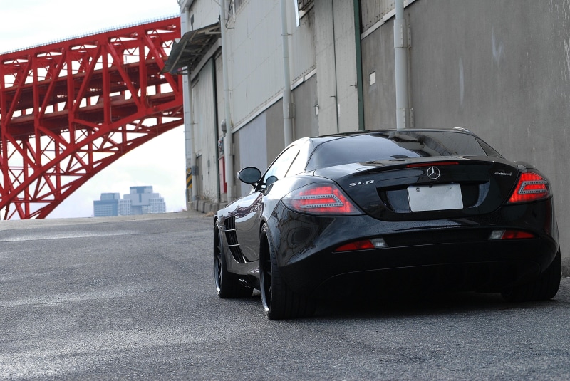 architecture, highway, building exterior, modern, black, coupe, car, wall, red, street, gate, pipe, mercedes, cityscape, outdoors, luxury, bridge, urban Scene